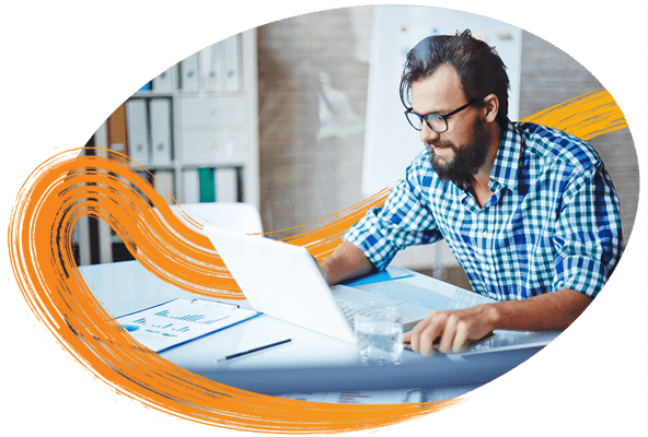 man-leaning-forward-on-laptop