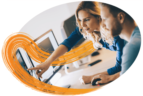 two-people-looking-at-a-monitor