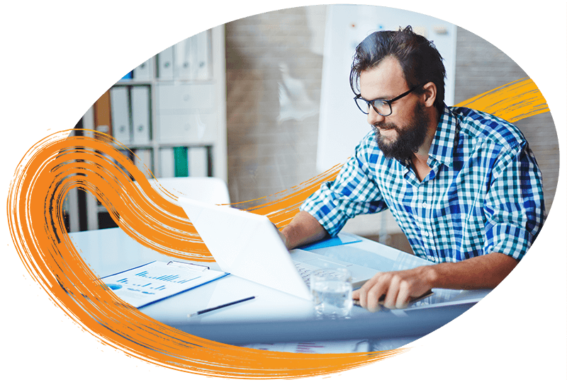 man-leaning-forward-on-laptop