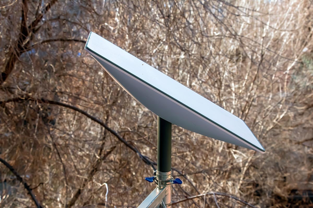 starlink satellite flat dish in a rural setting