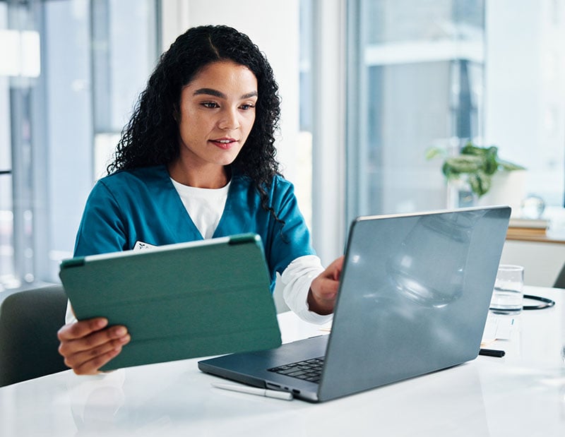 person-using-tabet-and-laptop