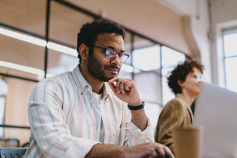 man with hand on chin